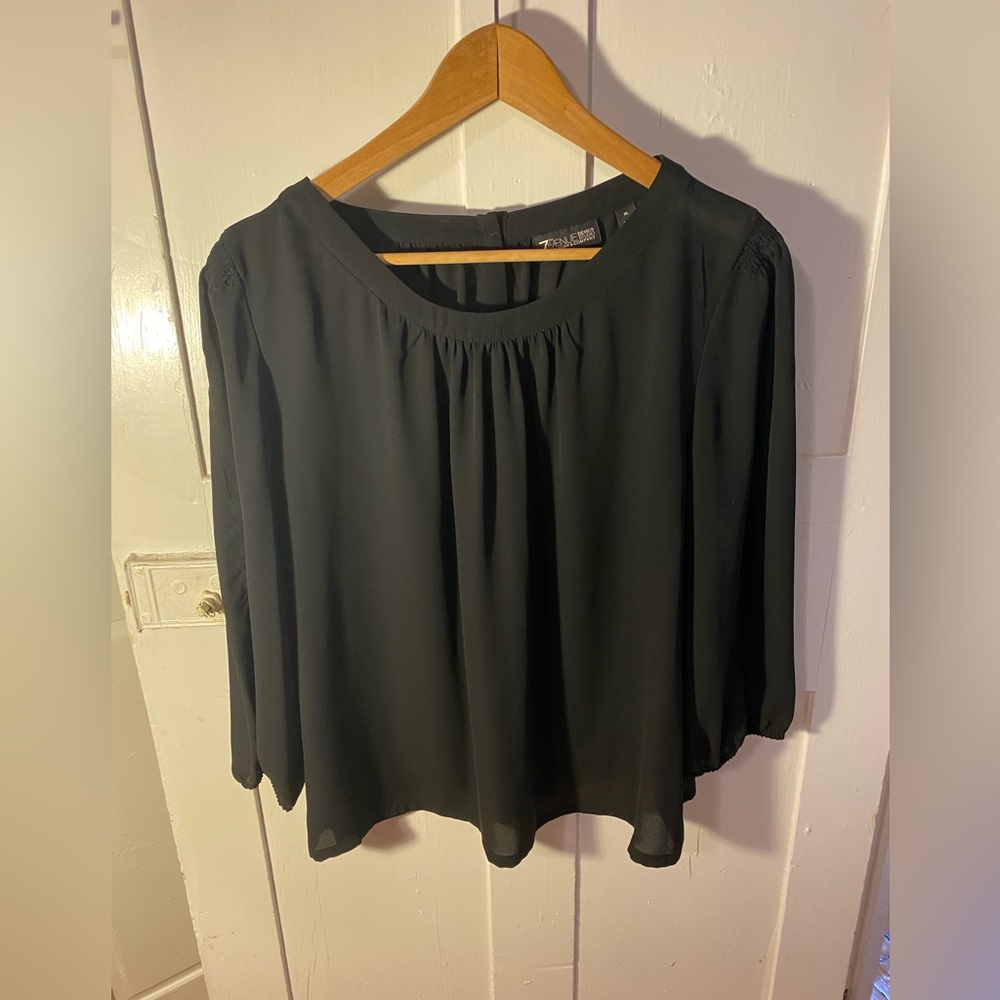 Black blouse with silver buttons